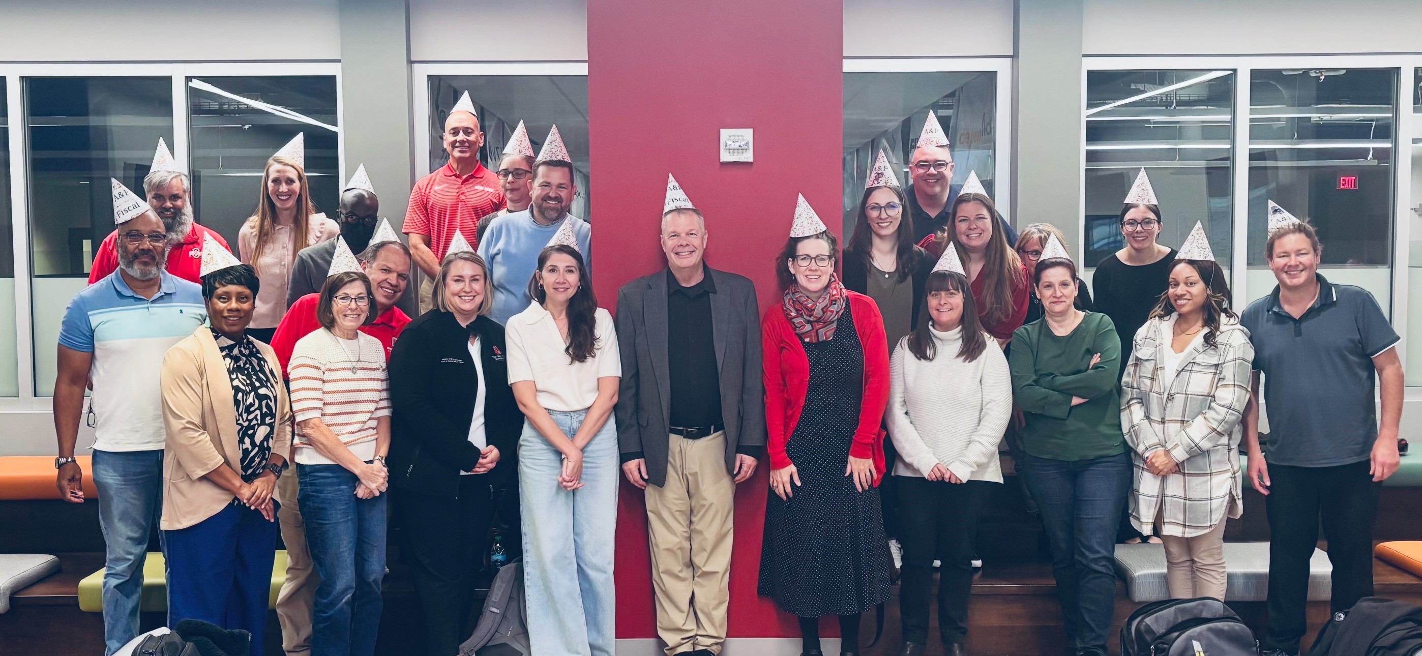 group of people with birthday hats