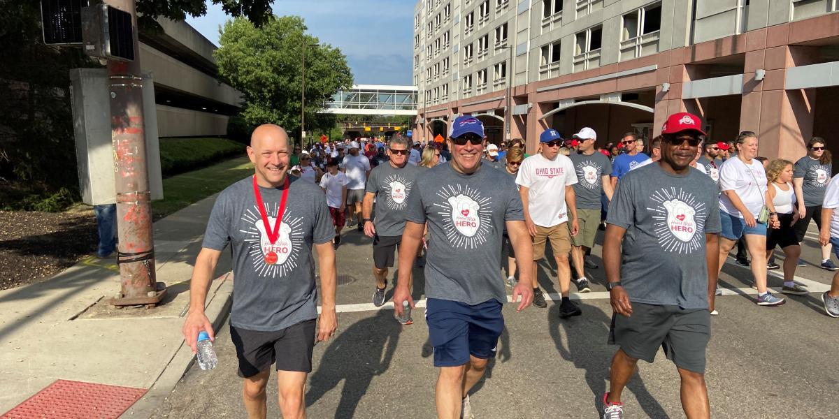 three people walking during heart walk