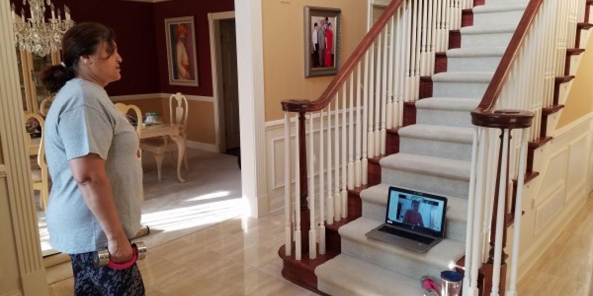 woman preparing to walk upstairs