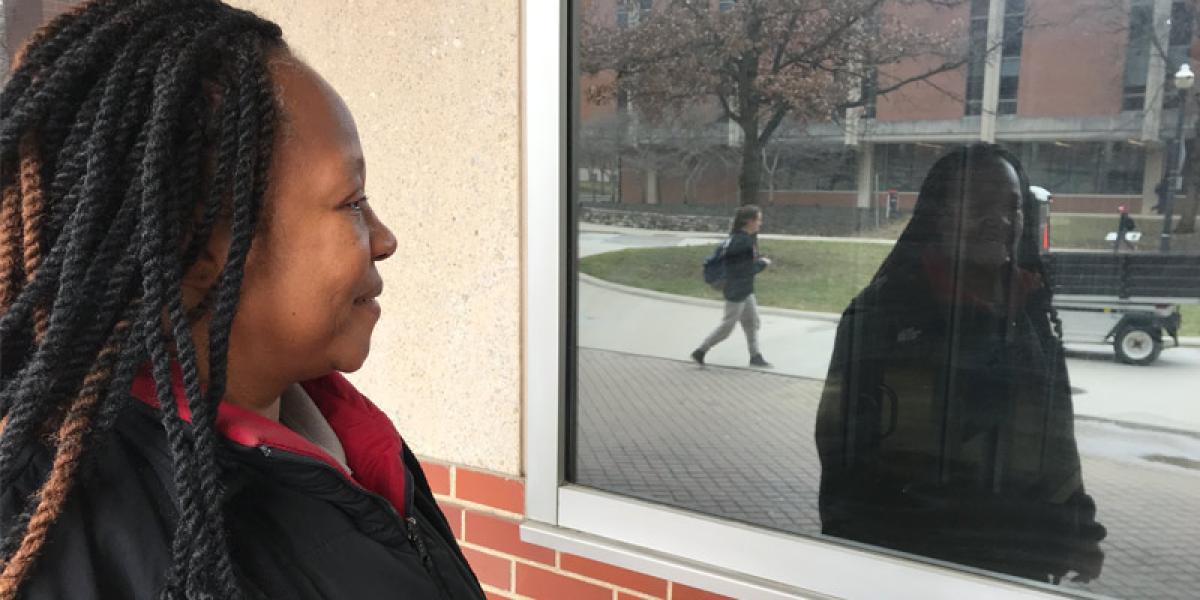 woman looking at her reflection