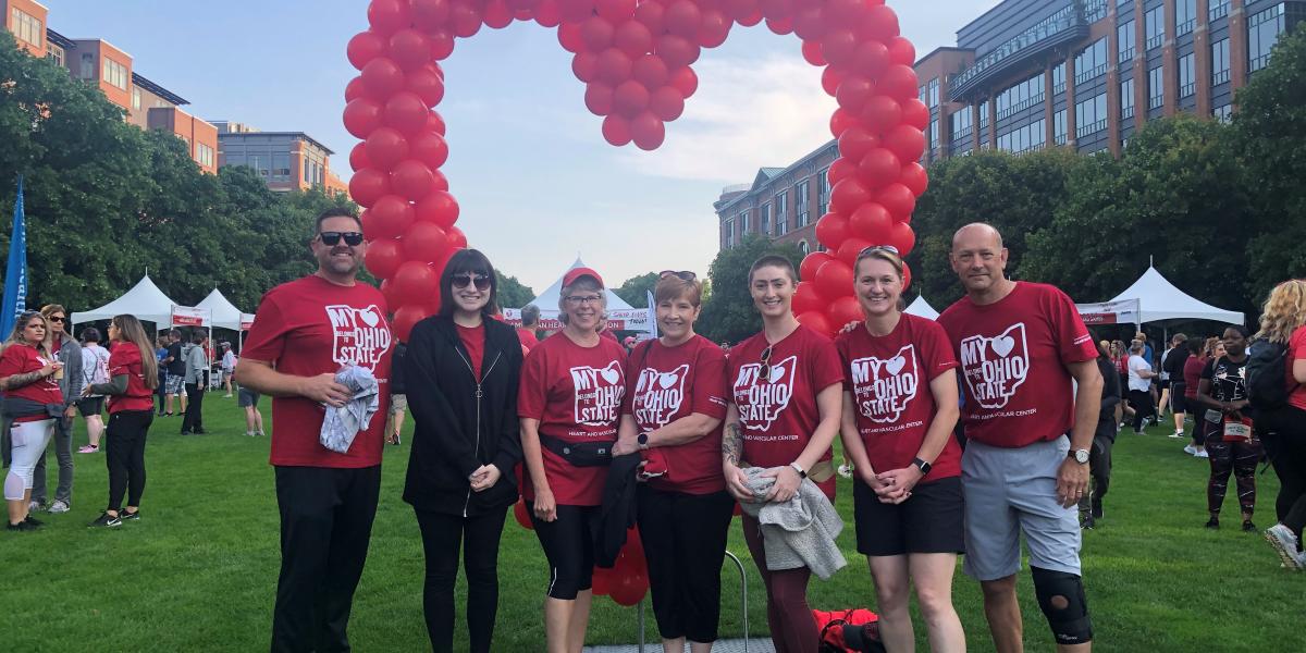 FOD heart walk team standing in front of balloons positioned in the shape of a heart