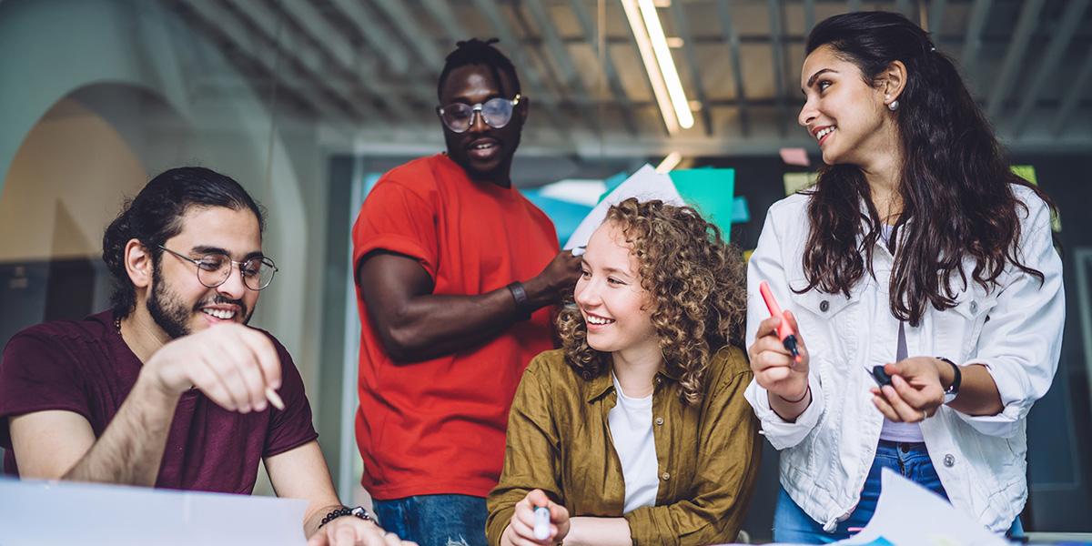 group of people near a table working on a project