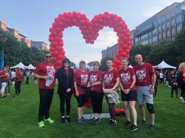 FOD heart walk team standing in front of balloons positioned in the shape of a heart