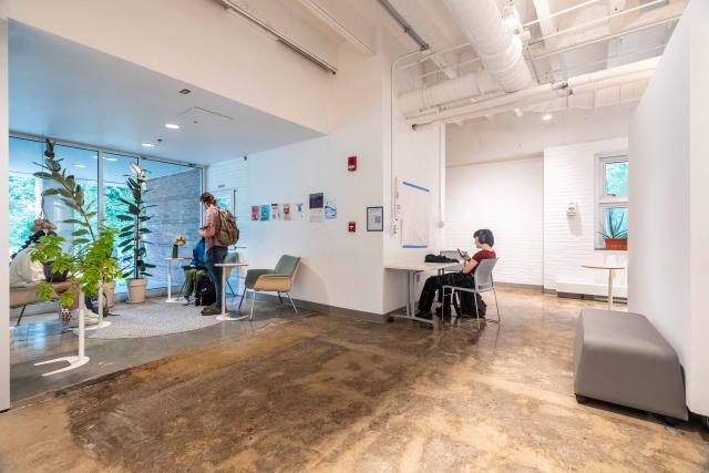 Photo of a renovated lobby with students